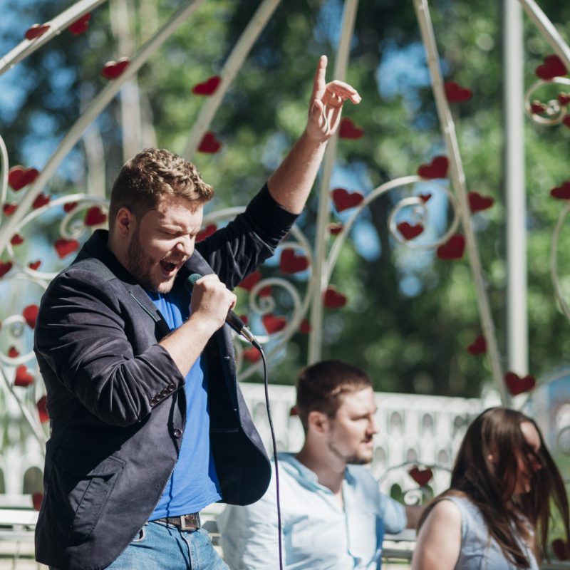 artistic-male-singing-song-microphone